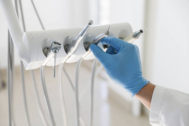 Professional Tooth Extraction technician working in Great Falls Crossing, VA